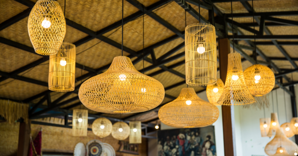 Row of wicker pendant lights hang from a restaurant ceiling. 