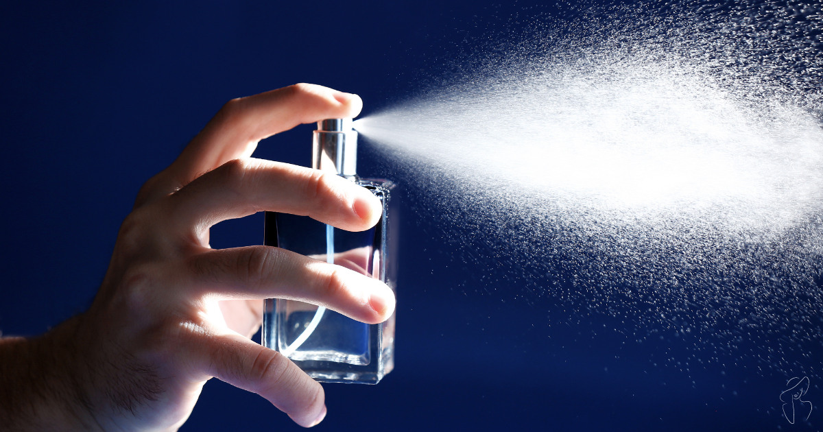 A close-up photo of a hand spraying a silver perfume bottle with a blue nozzle indicating  is this according to the Fragrance Wheel?