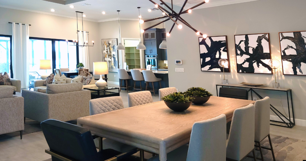 A living room with a dining table and chairs.