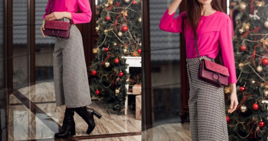  An elegant lady wearing a pink shirt and striped black and white  skirt